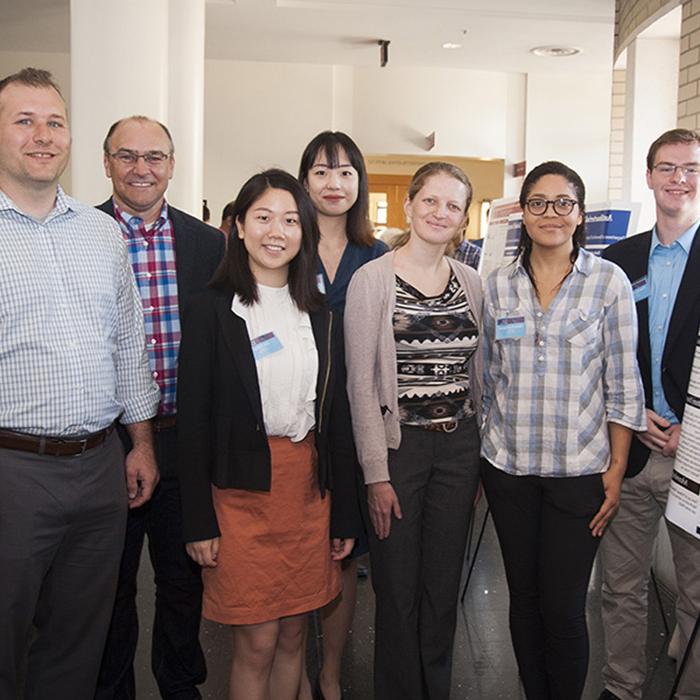 A group from C.H. Robinson — Elena Yudovina, data scientist, who was the point of contact for the student team; Brett Cooksey, director of technology, digitalization strategy; and Ian Allison, a senior sales executive